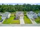 Aerial view of a well-maintained two-story home with a green lawn and a long driveway at 199 Meadow Wood Rd, Summerville, SC 29486