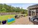 Backyard patio with outdoor seating area and fire pit, perfect for entertaining guests at 199 Meadow Wood Rd, Summerville, SC 29486