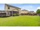 Spacious backyard with green lawn and trampoline, perfect for outdoor enjoyment at 199 Meadow Wood Rd, Summerville, SC 29486