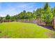 Fenced backyard with green lawn and wood fence offering privacy and security at 199 Meadow Wood Rd, Summerville, SC 29486