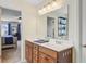 Bright bathroom boasts a double sink vanity, neutral walls, and seamless flow to the bedroom at 199 Meadow Wood Rd, Summerville, SC 29486
