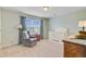 Charming Bedroom features a crib, rocking chair, and changing table bathed in gentle light at 199 Meadow Wood Rd, Summerville, SC 29486