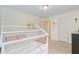 Bright bedroom with a white, house-frame bed and carpeted floors, filled with natural light at 199 Meadow Wood Rd, Summerville, SC 29486