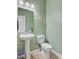 Stylish half bathroom with pedestal sink and neutral tones, offering a fresh and clean space at 199 Meadow Wood Rd, Summerville, SC 29486