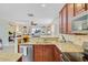 Well-appointed kitchen with granite counters, stainless appliances, and open layout to the living room at 199 Meadow Wood Rd, Summerville, SC 29486