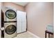 Efficient laundry room with stacked washer and dryer, maximizing space and functionality at 199 Meadow Wood Rd, Summerville, SC 29486