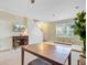 Open-concept living room with a table, plant, and entertainment center with mounted TV at 199 Meadow Wood Rd, Summerville, SC 29486