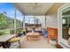 Inviting screened-in patio with comfortable seating and stylish decor, creating a perfect outdoor retreat at 199 Meadow Wood Rd, Summerville, SC 29486
