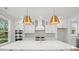 Gourmet kitchen featuring a large island, stainless steel appliances, and custom cabinetry at 2004 Sea Water Dr, Charleston, SC 29412