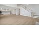 Open-concept living space with hardwood floors, and a seamless flow into the kitchen at 2004 Sea Water Dr, Charleston, SC 29412
