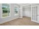 Bright office space featuring French doors, hardwood floors, and large windows at 2004 Sea Water Dr, Charleston, SC 29412