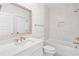 Bright bathroom featuring white cabinets, quartz countertop, and modern gold fixtures throughout the space at 2006 Riverbend Dr, Charleston, SC 29412