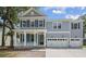 Charming two-story home with blue shutters and a welcoming front porch at 2006 Riverbend Dr, Charleston, SC 29412