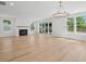 Bright living room featuring hardwood floors, fireplace and lots of natural light at 2006 Riverbend Dr, Charleston, SC 29412