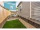The backyard features stone pavers, a grassy patch, and a cozy seating area on a wooden deck at 202 Fishburne St, Charleston, SC 29403
