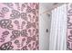 Bathroom featuring a patterned wallpaper, and shower with white subway tile at 202 Fishburne St, Charleston, SC 29403
