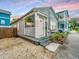 Charming single-story home showcasing a quaint porch, light-blue siding, and tidy landscaping at 202 Fishburne St, Charleston, SC 29403