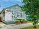 Charming single-story home featuring quaint porch, light-blue siding, and window box at 202 Fishburne St, Charleston, SC 29403