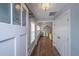Welcoming foyer with hardwood floors, natural light, and elegant chandelier at 202 Fishburne St, Charleston, SC 29403