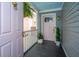 Inviting front porch featuring a hanging fern and a pink front door at 202 Fishburne St, Charleston, SC 29403
