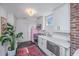 Bright kitchen with white cabinets, stainless steel appliances, and a pink refrigerator at 202 Fishburne St, Charleston, SC 29403