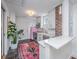Bright kitchen featuring white cabinets, brick accents, and stainless steel appliances at 202 Fishburne St, Charleston, SC 29403