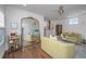 Stylish living room with hardwood floors, a ceiling fan, and a large mirror at 202 Fishburne St, Charleston, SC 29403