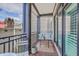 Cozy balcony with comfortable seating and a small table offering a relaxing outdoor space at 21 George St # 203, Charleston, SC 29401