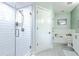 Bright bathroom with a glass-enclosed shower, white subway tiles, and neutral color palette at 21 George St # 203, Charleston, SC 29401