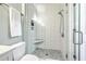 Modern bathroom featuring a glass walk-in shower, and a white towel at 21 George St # 203, Charleston, SC 29401