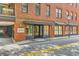 Exterior view of the attractive brick building with well-maintained landscaping at 21 George St # 203, Charleston, SC 29401