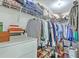 Organized walk-in closet with shelving, drawers, and hanging rods, providing ample storage at 21 George St # 203, Charleston, SC 29401