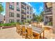 A large, beautiful courtyard offers multiple seating areas and lush greenery at 21 George St # 203, Charleston, SC 29401