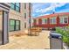 Exterior courtyard with outdoor seating and lush landscaping is the perfect spot to enjoy at 21 George St # 203, Charleston, SC 29401