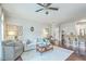 Cozy living room features a neutral color scheme, comfortable seating, and an open layout connecting to the kitchen at 21 George St # 203, Charleston, SC 29401