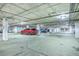 Underground parking garage with designated parking spots and ample lighting at 21 George St # 203, Charleston, SC 29401