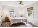 Cozy bedroom with neutral tones, wood floors, and natural light, creating a relaxing and inviting space at 22 Charlestowne Rd, Charleston, SC 29407