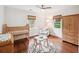 Charming bedroom featuring a crib, -size table, and bright windows, designed as a comfortable bedroom at 22 Charlestowne Rd, Charleston, SC 29407