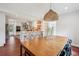 Dining area open to the kitchen, featuring a wooden table and modern seating, perfect for entertaining at 22 Charlestowne Rd, Charleston, SC 29407
