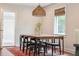 Warm dining room featuring a wooden table, modern lighting, and an eye-catching woven pendant light fixture at 22 Charlestowne Rd, Charleston, SC 29407