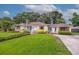 Well-maintained home with a lush green lawn and driveway, showcasing its inviting curb appeal at 22 Charlestowne Rd, Charleston, SC 29407