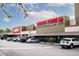 Exterior view of Earth Fare and Staples in a shopping center with parked cars under a partly cloudy sky at 22 Charlestowne Rd, Charleston, SC 29407