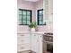 Bright kitchen with marble countertops, stainless steel oven, and ample storage space, highlighted by a unique backsplash at 22 Charlestowne Rd, Charleston, SC 29407