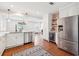Open-concept kitchen with stainless steel appliances, ample counter space, and a view into the adjacent living area at 22 Charlestowne Rd, Charleston, SC 29407