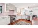 Modern kitchen features stainless steel appliances, white cabinets, and stylish backsplash, creating a clean, contemporary design at 22 Charlestowne Rd, Charleston, SC 29407