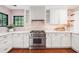 Modern kitchen featuring white cabinets, quartz countertops, and stainless steel appliances at 22 Charlestowne Rd, Charleston, SC 29407