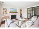 Bright and airy living room featuring hardwood floors, decorative fireplace, and comfortable seating at 22 Charlestowne Rd, Charleston, SC 29407