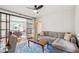 Cozy living room with a sectional sofa, modern glass doors, and a bright office space at 22 Charlestowne Rd, Charleston, SC 29407