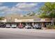 Commercial building with parking lot of shops including Urban Nirvana, Baker's Bar, and Lifeworks at 22 Charlestowne Rd, Charleston, SC 29407