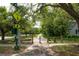Scenic walking path surrounded by lush greenery and mature trees near community at 22 Charlestowne Rd, Charleston, SC 29407